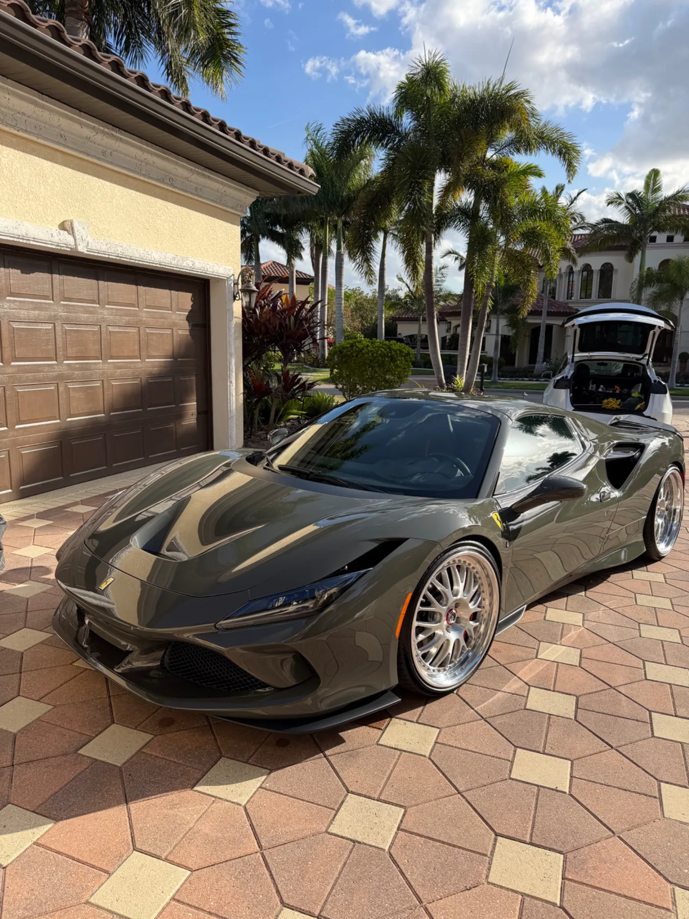 Dark grey Ferrari with a glossy reflective finish