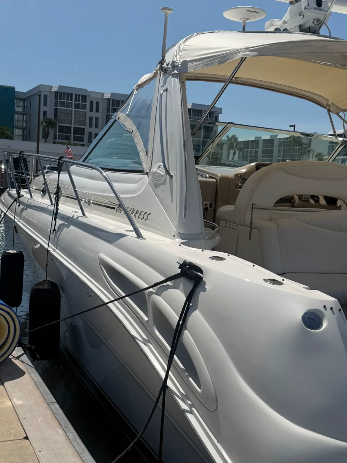 Clean white cruiser exterior presented dockside