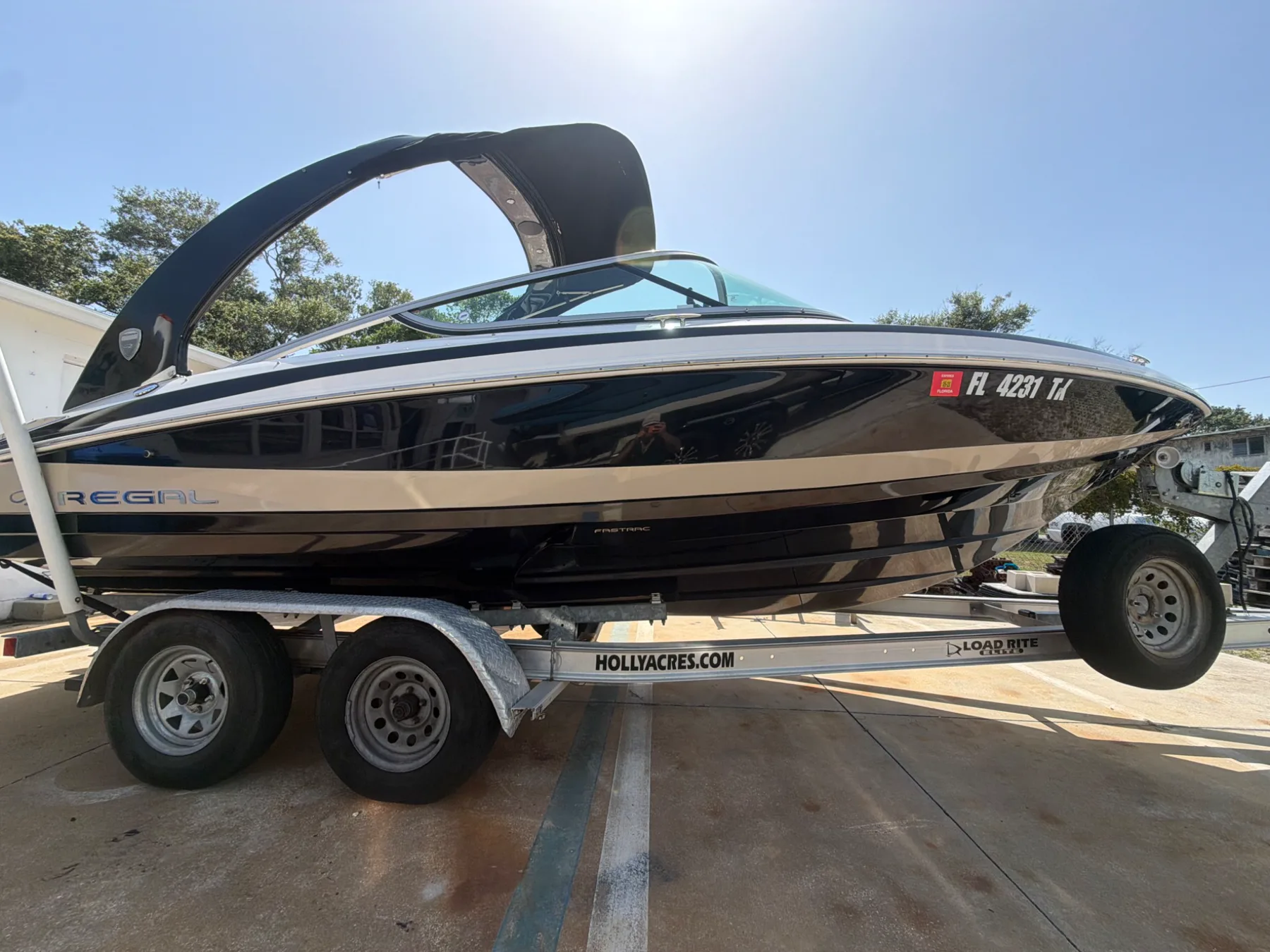 Black and white Regal boat on its trailer