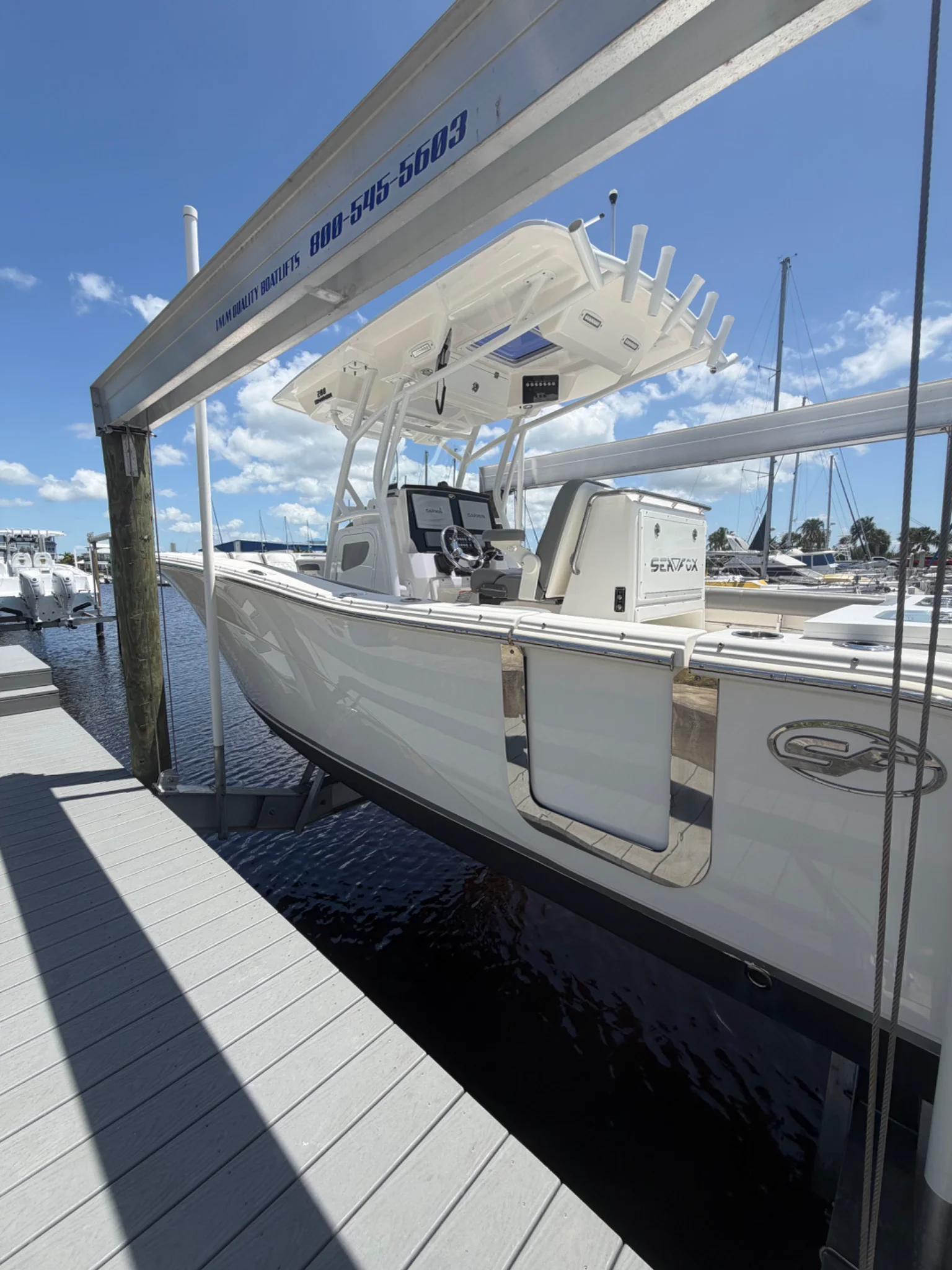 White SeaVee center-console cockpit and helm presented dockside