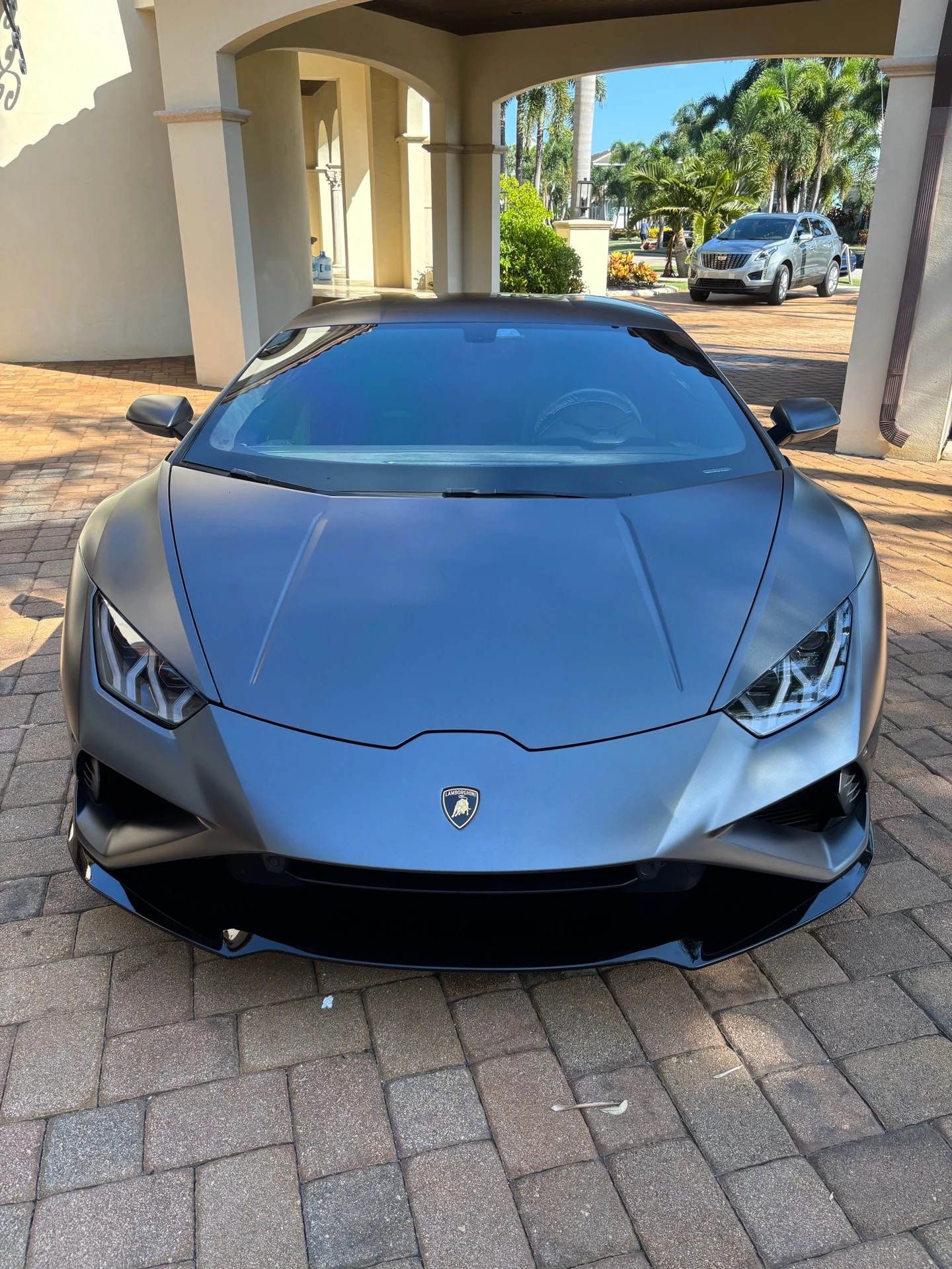 Matte gray Lamborghini photographed from the front after Mighty Munch automotive work
