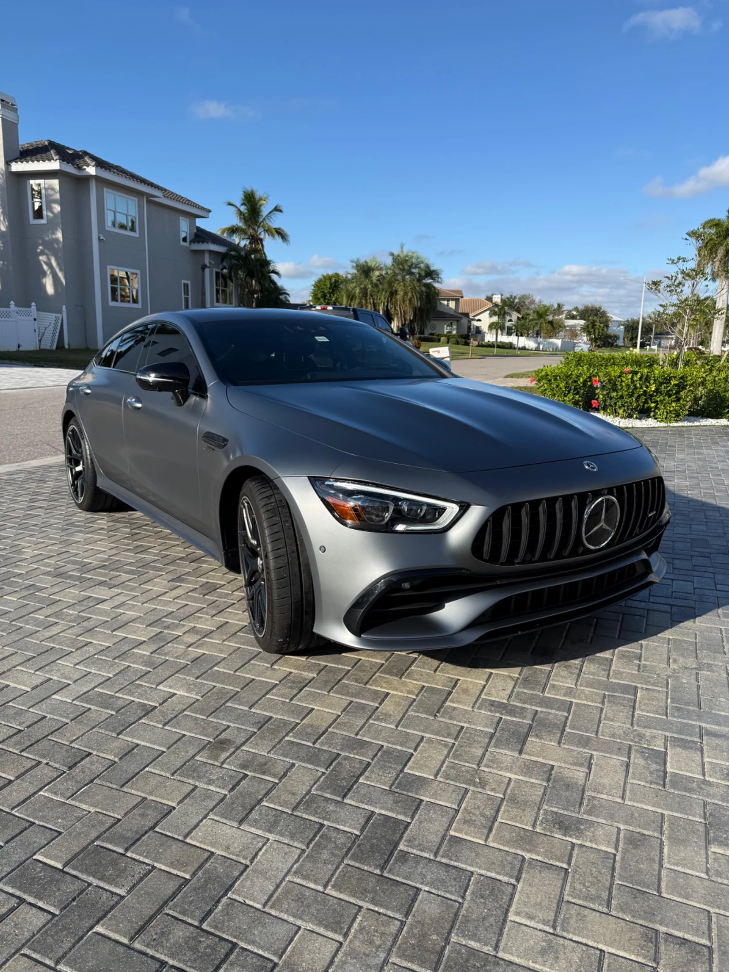 Matte gray Mercedes-AMG photographed from the front three-quarter angle