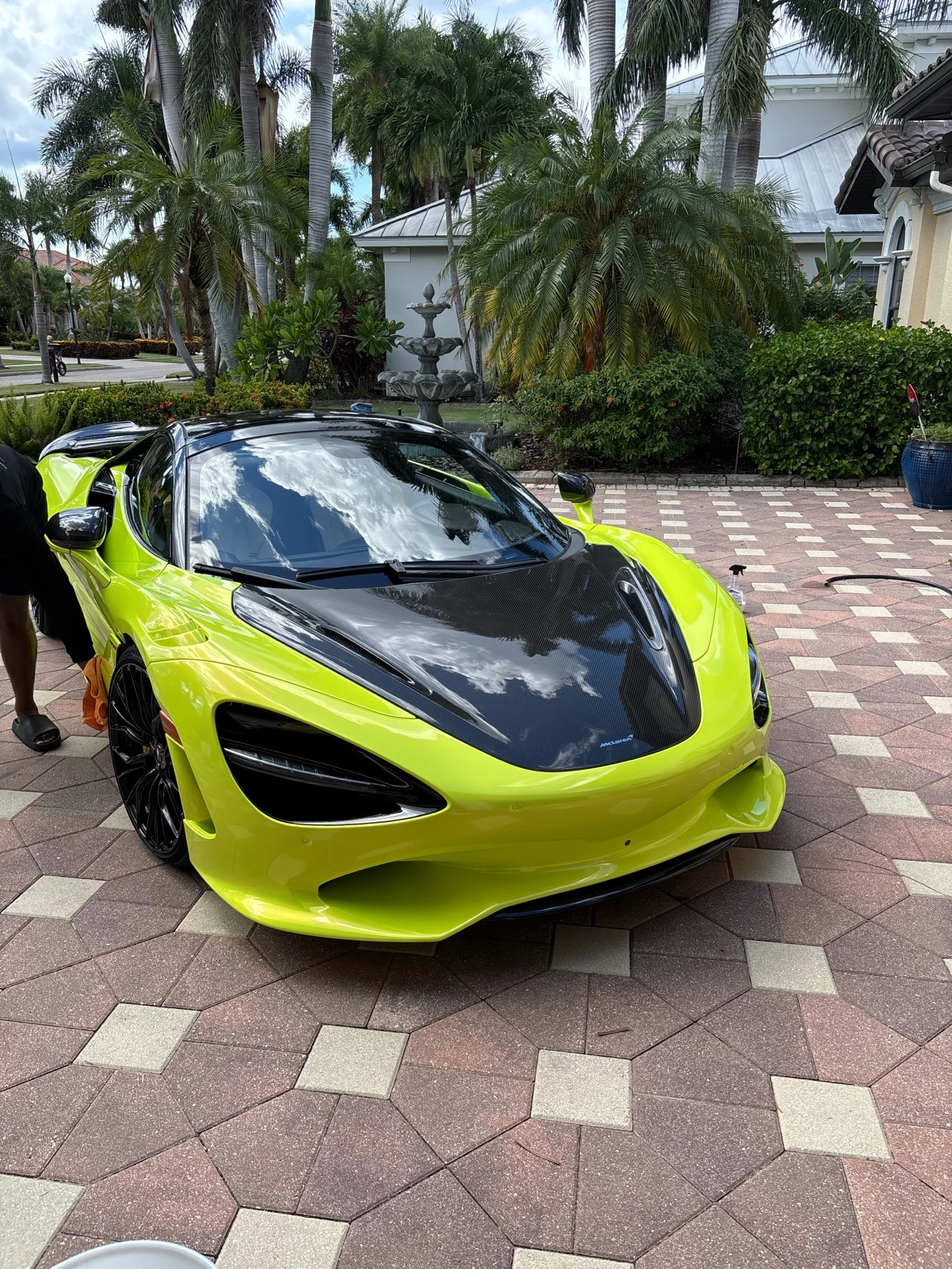 Lime green McLaren photographed from the front three-quarter angle after Mighty Munch automotive work