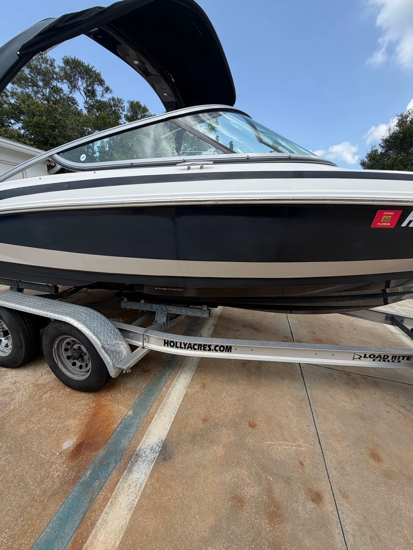 Black Regal hull before gelcoat correction, with a faded and hazy finish